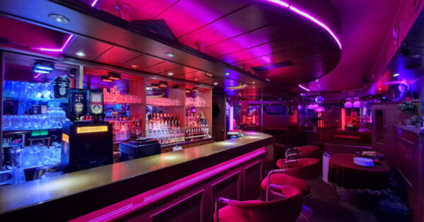 Main bar and social space inside SwingerForYou Budapest, where couples gather to chat, enjoy drinks, and meet throughout the evening.