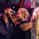 A nervous couple arriving together for their first swinger club experience, holding hands and smiling with anticipation.