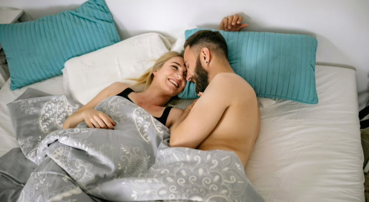 Couple sharing an intimate moment after a swinger club night, experiencing emotional connection and calm afterglow