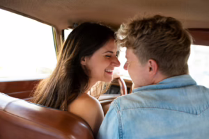 Couple holding hands during the car ride home after a swinger club night, reflecting on emotions and trust.