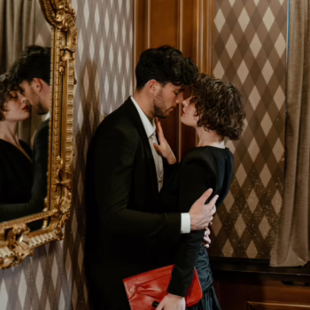 Elegant couple sharing an intimate moment, symbolizing trust, desire, and emotional connection in wife sharing relationships