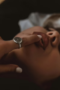 Close-up of an intimate touch representing trust, desire, and emotional connection in consensual wife swapping relationships