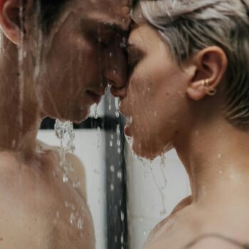 Couple sharing an intimate moment under a shower, symbolizing trust, consent, and emotional closeness in wife sharing in practice