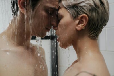 Couple sharing an intimate moment under a shower, symbolizing trust, consent, and emotional closeness in wife sharing in practice