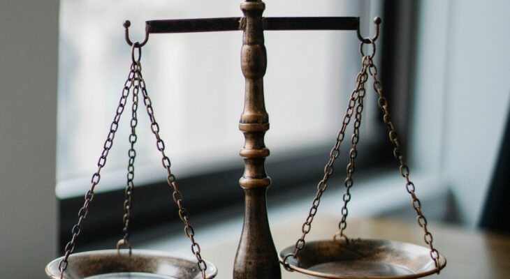 Balance scale symbolizing the pros and cons of swinging and relationship decision-making