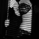 Sensual black and white lingerie silhouette representing intimacy and double penetration lifestyle exploration