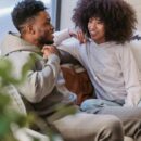 Couple sitting on a couch talking openly, representing communication and trust when discussing swinger couple goals and fantasies. Small SEO tip for WordPress (important): When uploading, also set: Caption (optional but good for engagement) Example: Open communication and trust are the foundation of healthy swinger couple goals. Description (WordPress media field) You can paste the same text as the alt text or a slightly expanded version. If you want, I can also show you which one should be the featured image and why, because one of these will perform much better for clicks from Google Discover and Pinterest-style previews.