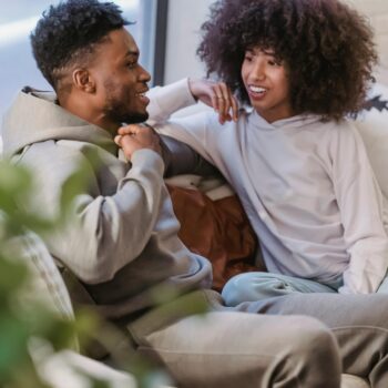 Couple sitting on a couch talking openly, representing communication and trust when discussing swinger couple goals and fantasies. Small SEO tip for WordPress (important): When uploading, also set: Caption (optional but good for engagement) Example: Open communication and trust are the foundation of healthy swinger couple goals. Description (WordPress media field) You can paste the same text as the alt text or a slightly expanded version. If you want, I can also show you which one should be the featured image and why, because one of these will perform much better for clicks from Google Discover and Pinterest-style previews.