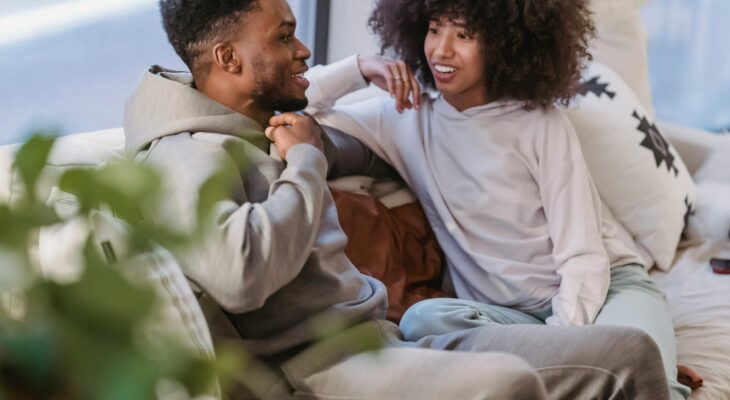 Couple sitting on a couch talking openly, representing communication and trust when discussing swinger couple goals and fantasies. Small SEO tip for WordPress (important): When uploading, also set: Caption (optional but good for engagement) Example: Open communication and trust are the foundation of healthy swinger couple goals. Description (WordPress media field) You can paste the same text as the alt text or a slightly expanded version. If you want, I can also show you which one should be the featured image and why, because one of these will perform much better for clicks from Google Discover and Pinterest-style previews.