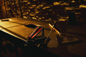 Playroom equipment at Swinger Club Paradiso including padded table and accessories in a dimly lit setting