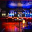 Main bar and social area at Tucan Club Denmark with soft lighting, seating, and relaxed lounge atmosphere