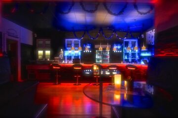 Main bar and social area at Tucan Club Denmark with soft lighting, seating, and relaxed lounge atmosphere