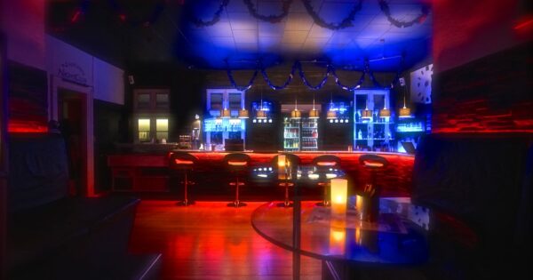 Main bar and social area at Tucan Club Denmark with soft lighting, seating, and relaxed lounge atmosphere