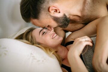Happy couple sharing an intimate moment while exploring their swinging sex life
