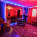 Red and purple BDSM room with bondage furniture and mirrors inside Lillith Club near Munich